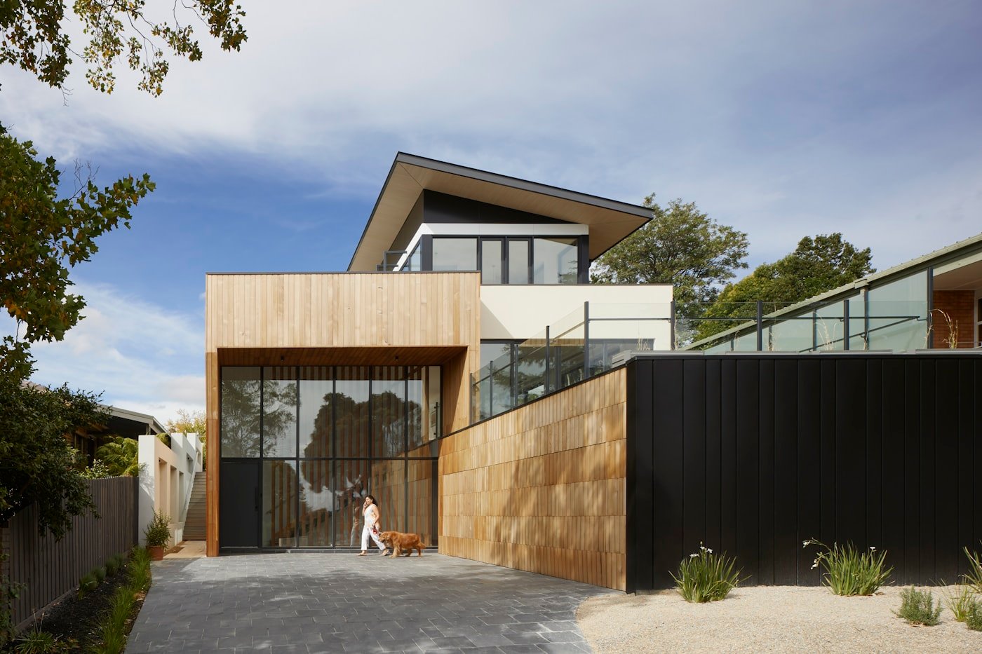 Modern residential property with wood and dark exterior finish details